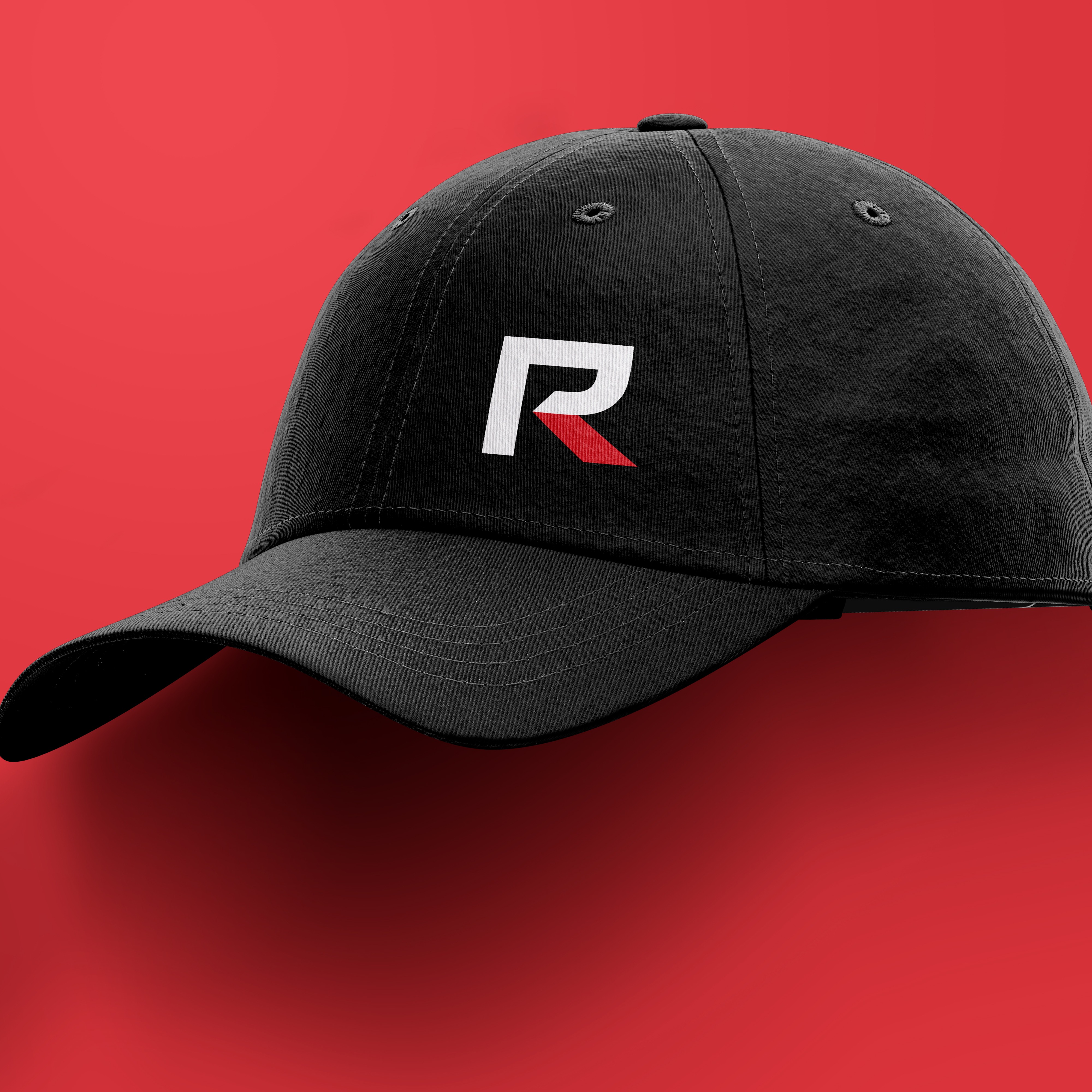 Black baseball cap with white and red RevolutionParts R logo on a red background